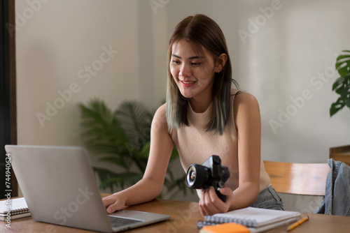 Creative design concept, Fashion designer checking picture in laptop of new collection clothes