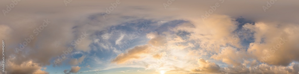 Obraz premium Dark blue sunset sky with glowing golden Cumulus clouds in seamless panorama. HDR 360 spherical format for 3D visualization and sky replacement in aerial drone photos.