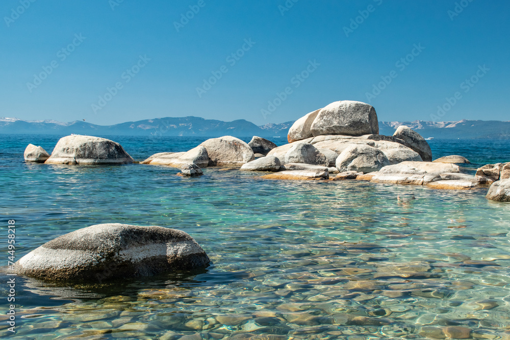 Fototapeta premium North Shore of Lake Tahoe Secret Harbor with giant granite boulders in clear blue turquoise water on a bright sunny day 