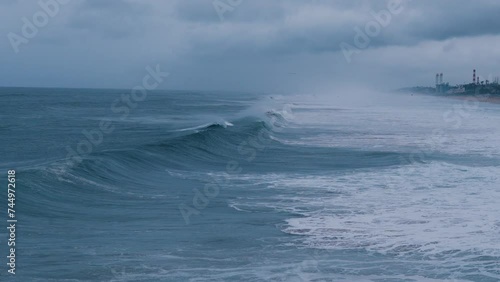 Giant Ocean Waves Crashing On California Seashore Coastline Beach In Los Angeles On Cloudy Stormy Day