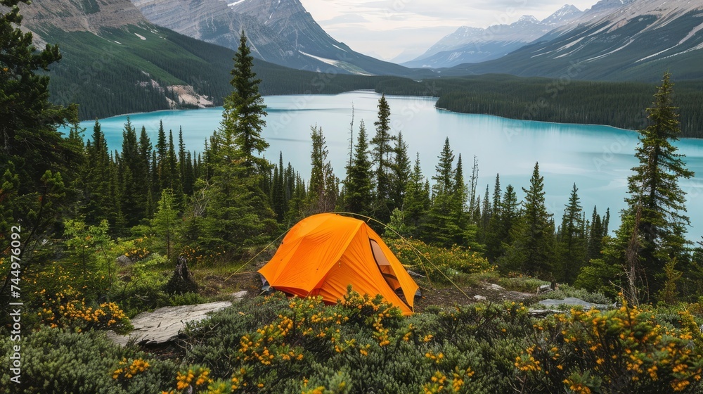 People Camping against a lake and mountain