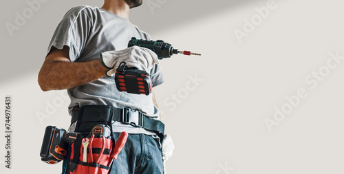 Professional repairman using a drill