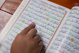 Boys read Quran Kareem in the mosque, with the theme of fasting