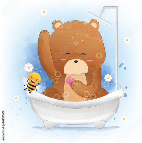 Cute little bear bathes in a bath and plays with soap bubbles.