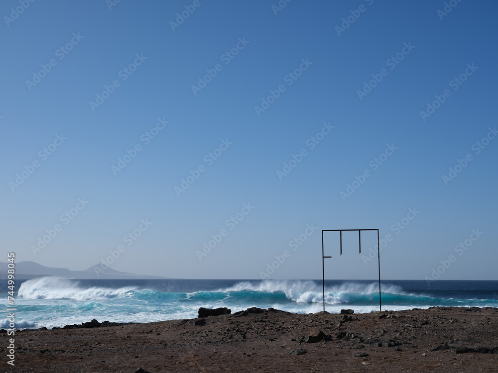 Steel structure, waves and ocean view in Las Palmas, Canary islands, Spain