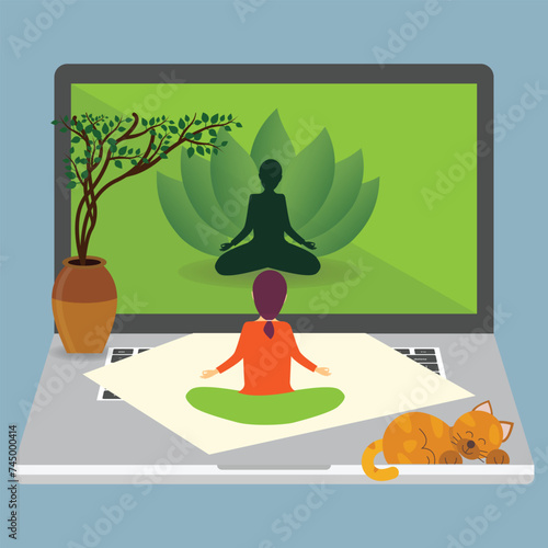 Woman sitting in lotus position on a mat on a big laptop and looking at the screen, online yoga concept