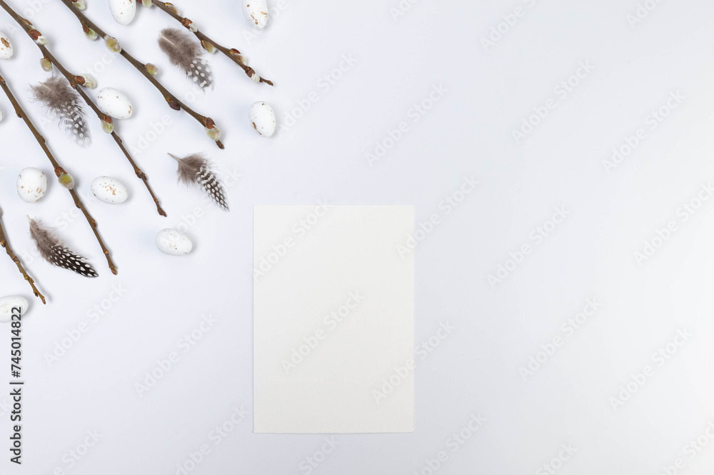 Top view of pussy willow branches, white easter eggs, white card and feathers on white background. Spring easter composition, copy space, flat lay. Top view of pussy willow branches, white easter eggs, white card and feathers on white background. Spring easter composition, copy space, flat lay.
