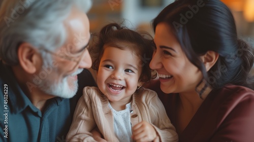 Happy multigenerational family moment with grandparent  mother  and child smiling together