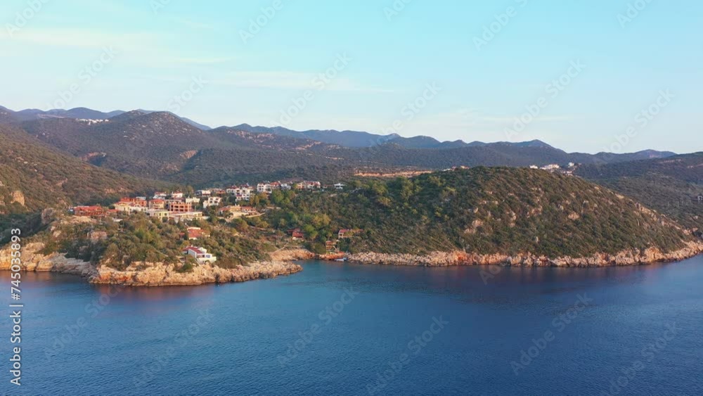 Rocky coast of Turkiye in Kas. Aerial view of rocky island in the sea Rocky coast of Turkiye in Kas. Aerial view of rocky island in the sea