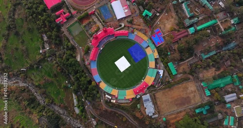 An aerial view from a top angle captures the beauty of the cricket stadium nestled in Dharamshala, Himachal Pradesh. photo