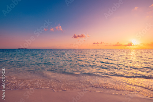 Summer nature sea sand sky, sunrise colors clouds, horizon, tranquil background banner. Inspirational nature landscape, beautiful colors, wonderful scenery tropical beach. Beach sunset vacation coast
