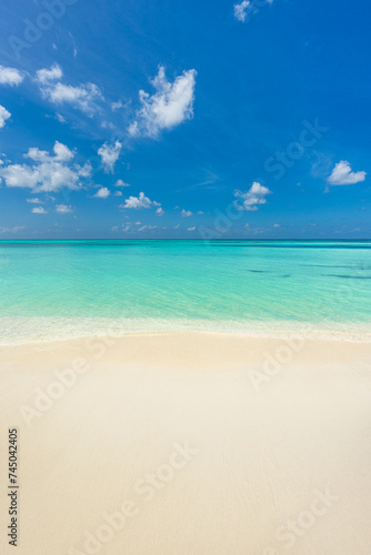 Closeup sand beach sea waves and blue summer sky. Panoramic beach landscape. Empty tropical beach and seascape, horizon. Bright exotic coast calmness, tranquil seaside nature view relaxing sunlight 