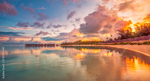 Fototapeta Naklejka Na Ścianę i Meble -  Amazing beach landscape. Beautiful Maldives sunset seascape view. Horizon colorful sea sky clouds, over water villa pier pathway. Tranquil island lagoon, tourism travel reflection. Exotic vacation