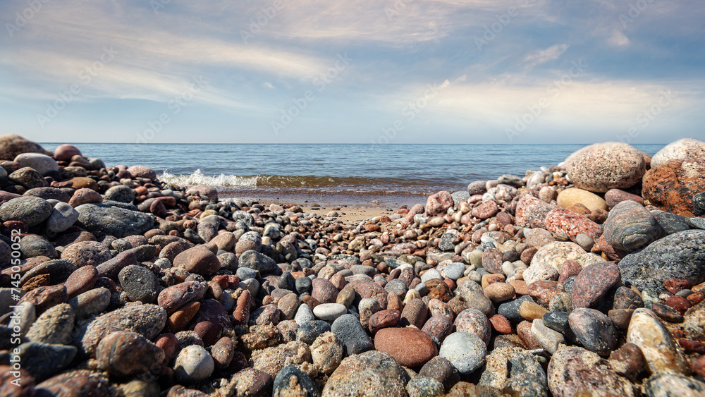 Pebble stone beach. Sea beach shore with waves in ocean. Pebble stone beach. Sea beach shore with waves in ocean.