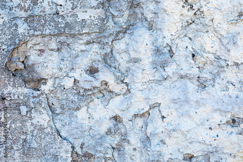 Glacier textures old plastered concrete wall with cracked and fallen paint, for background