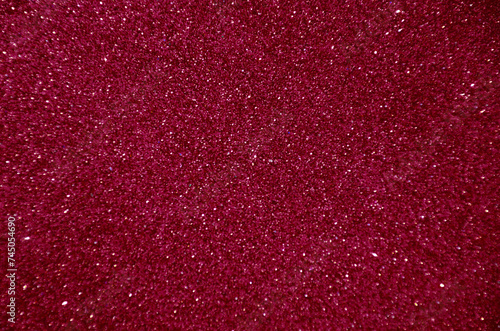 Burgundy blurred background with sparkles for text.