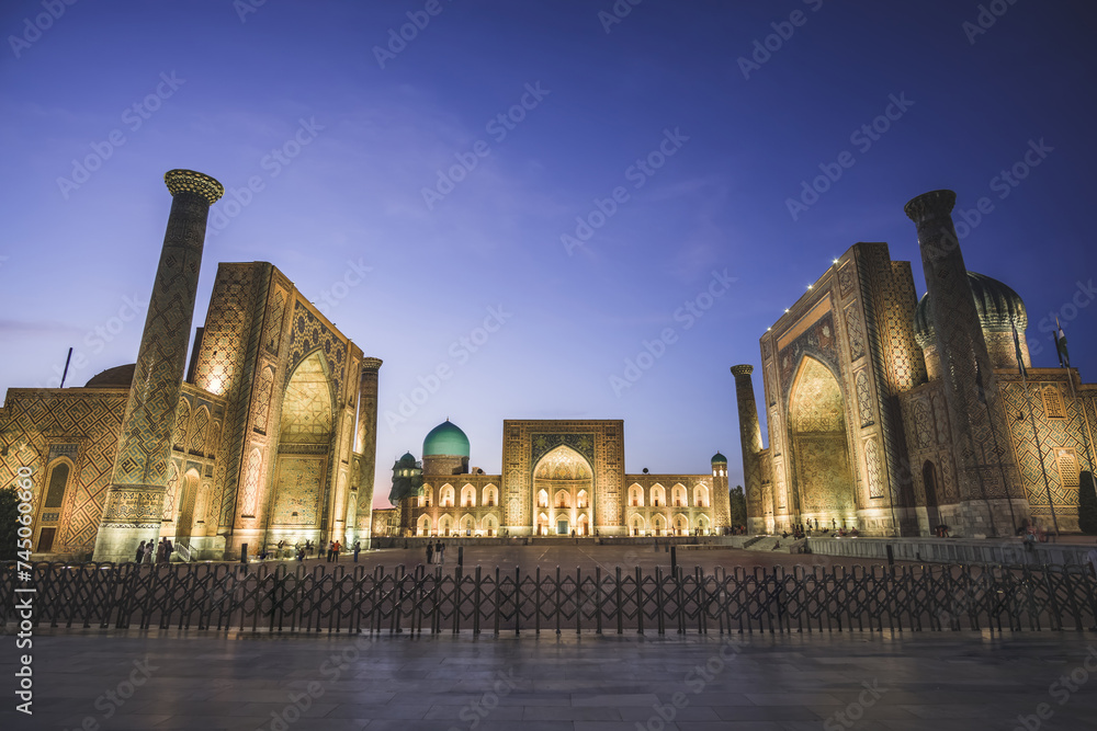 Registan Square, Ulugbek Madrasah, Sherdor Mosque Madrasah and Tillya-Kari Madrasah in the ancient city of Samarkand in Uzbekistan, oriental architecture in the evening with backlighting