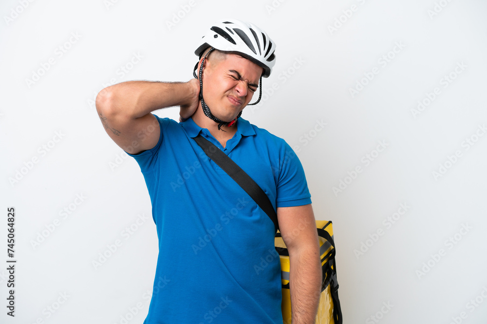 Fototapeta premium Young caucasian man with thermal backpack isolated on white background with neckache