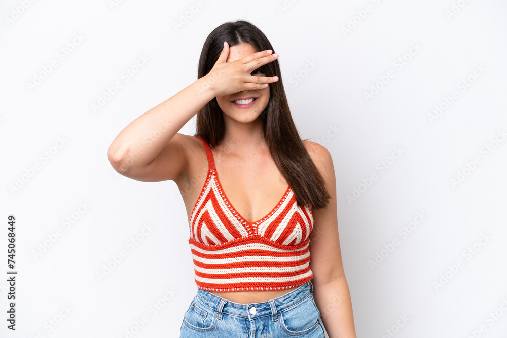 Young Brazilian woman isolated on white background covering eyes by hands and smiling Young Brazilian woman isolated on white background covering eyes by hands and smiling