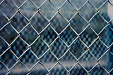 Chain-Link Fence Texture. The Metal Links and Surface Gloss of the Fence.