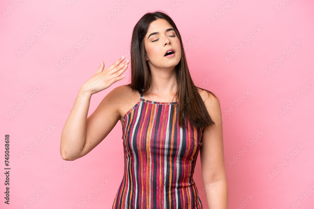 Young Brazilian woman isolated on pink background with tired and sick expression Young Brazilian woman isolated on pink background with tired and sick expression