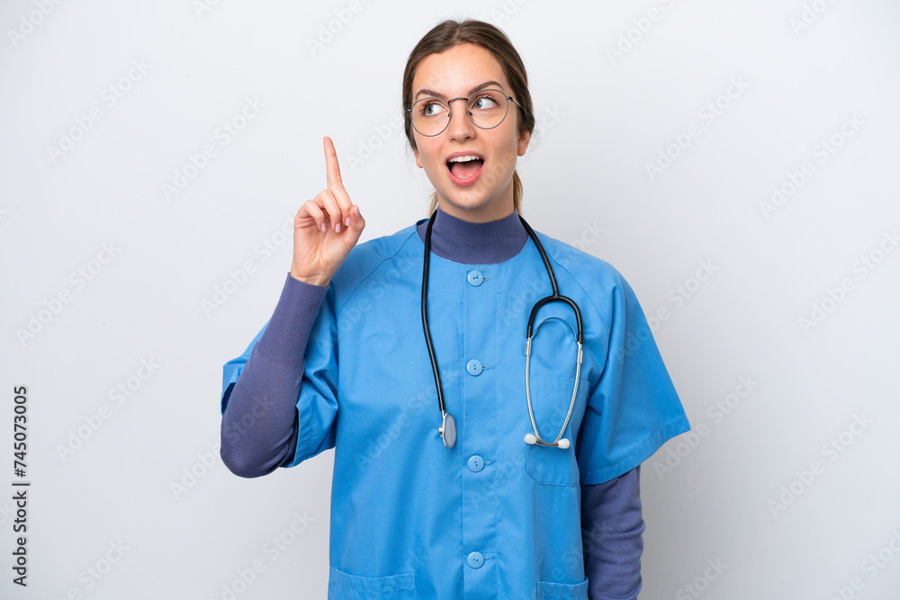 Young caucasian nurse woman isolated on white background intending to realizes the solution while lifting a finger up Young caucasian nurse woman isolated on white background intending to realizes the solution while lifting a finger up