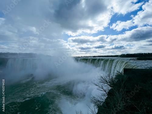 Niagara Falls, Ontario, Canada. Niagara Falls is the largest waterfall in the world. Beautiful view fro the ground near waterfall