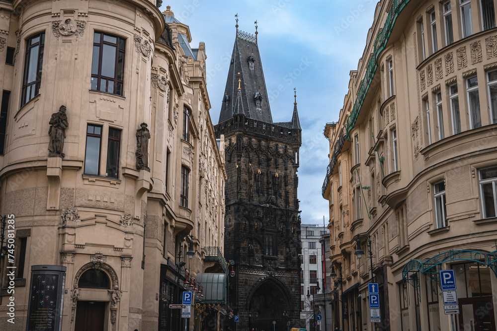 Gothic gunpowder towers visible through gaps in the city.