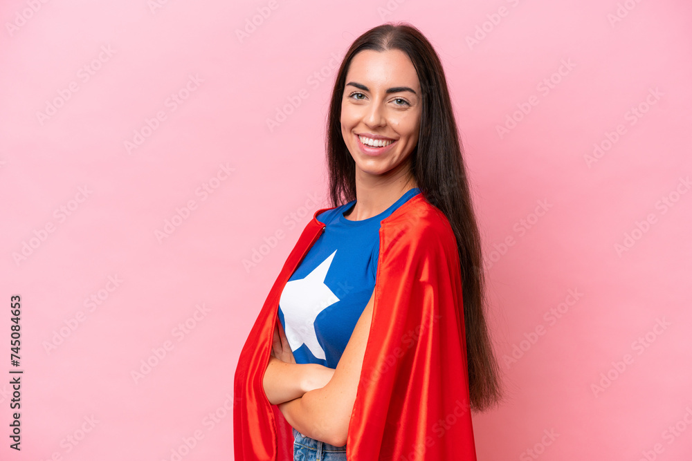 Super Hero Caucasian woman isolated on pink background with arms crossed and looking forward Super Hero Caucasian woman isolated on pink background with arms crossed and looking forward