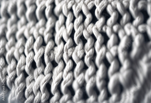 Knitted white texture with a pattern of braids