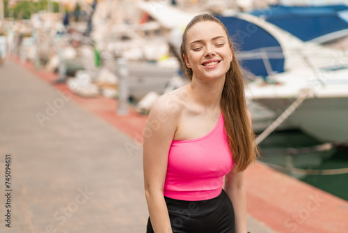 Young pretty sport girl at outdoors . Portrait