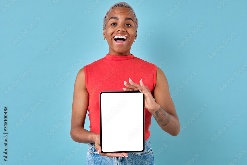 Young beautiful cheerful African American woman demonstrates tablet ...