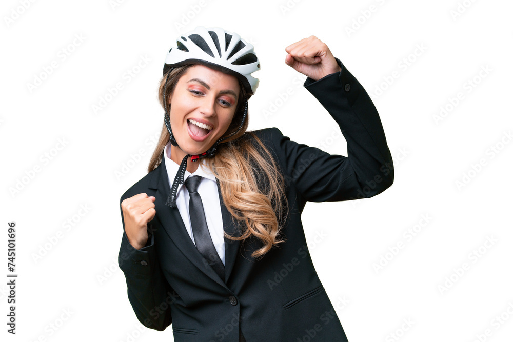 Business Uruguayan woman wearing a helmet biker over isolated background celebrating a victory Business Uruguayan woman wearing a helmet biker over isolated background celebrating a victory