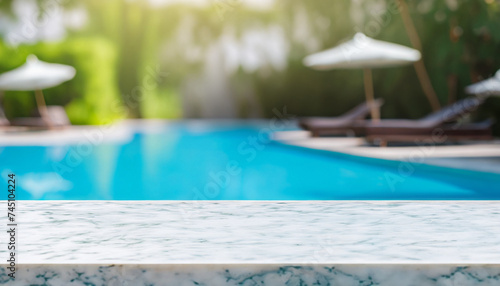 Empty white marble stone table top and blurred swimming pool in tropical resort in summer banner background - can used for display or montage your products. © Uuganbayar