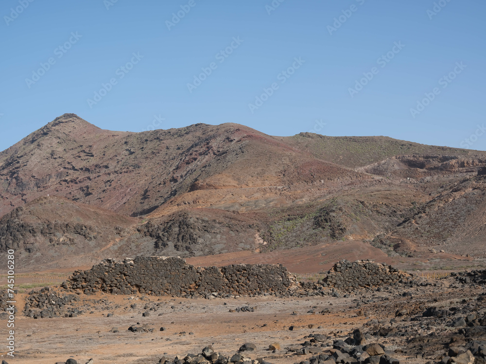 Barren hills and stone ruins on the edge of Las Palmas in the Canary islands, Spain Barren hills and stone ruins on the edge of Las Palmas in the Canary islands, Spain