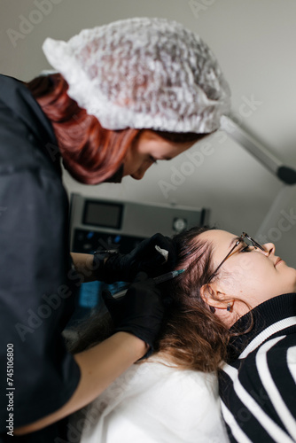 trichologist makes injections into the patient’s scalp for hair growth. A cosmetologist does mesotherapy for the scalp. PRP therapy for hair growth in alopecia