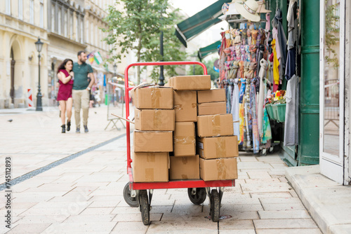 Cart with boxes in front of a shop