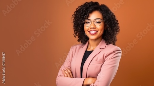 Confident African-American Woman with a Warm Smile in a Pink Blazer.