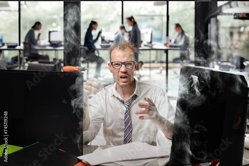Obraz na plátně Young unlucky office worker suffering from pain after computer repair, In-house