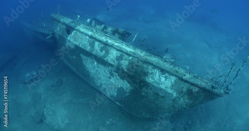 wreck underwater shipwreck on seabed sea floor standing metal on ocean floor some fish around