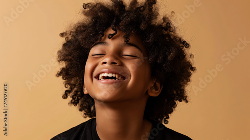 Wallpaper Mural portrait of african descendant boy smiling with eyes closed, copy space Torontodigital.ca