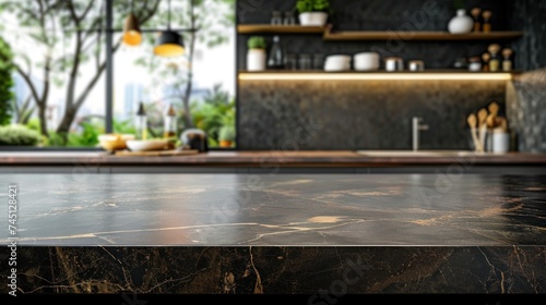 A modern  empty dark marble counter top or kitchen island in a clean and contemporary kitchen setting.