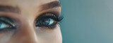 Woman Smokey Eye Makeup Close-up. Female eyes with smokey eye make-up, blended shadows, long black lashes with mascara, copy space.