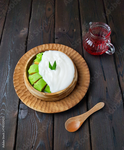 Green banana ice is a kind of food typical of Makassar in South Sulawesi.  This food is made from the main ingredient of bananas wrapped in green flour dough. Es Pisang Hijau. Takjil.  
 photo