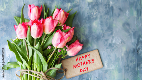 tulips on a table with happy mothers day wish card