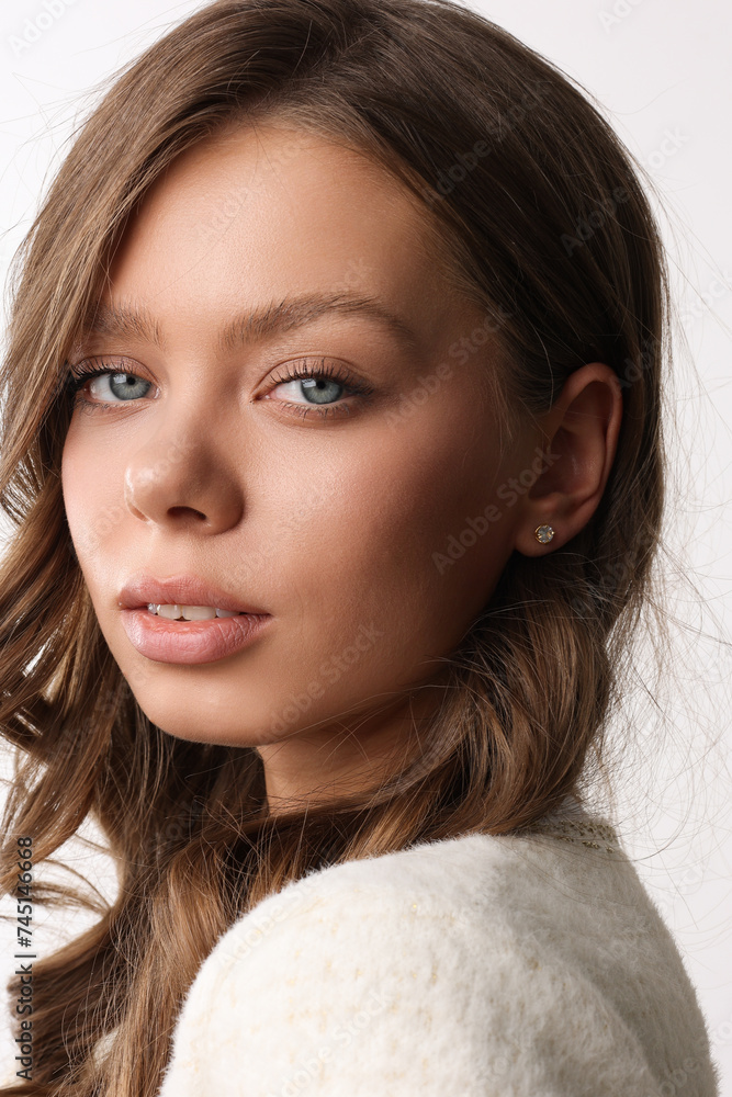 Beautiful young girl with fresh healthy skin. Woman advertise ear-rings. White background. Earrings closeup. Blond european woman with long hair with big lips, pretty smile. Cosmetology, scincare. Beautiful young girl with fresh healthy skin. Woman advertise ear-rings. White background. Earrings closeup. Blond european woman with long hair with big lips, pretty smile. Cosmetology, scincare.