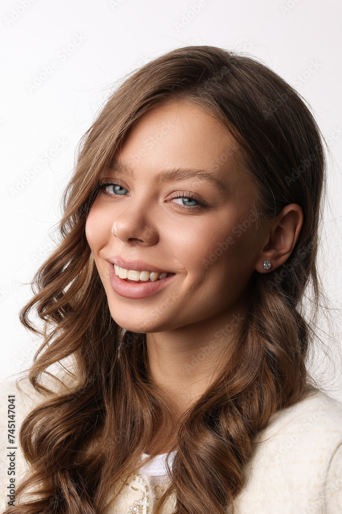 Beautiful young girl with fresh healthy skin. Woman advertise ear-rings. White background. Earrings closeup. Blond european woman with long hair with big lips, pretty smile. Cosmetology, scincare. Beautiful young girl with fresh healthy skin. Woman advertise ear-rings. White background. Earrings closeup. Blond european woman with long hair with big lips, pretty smile. Cosmetology, scincare.