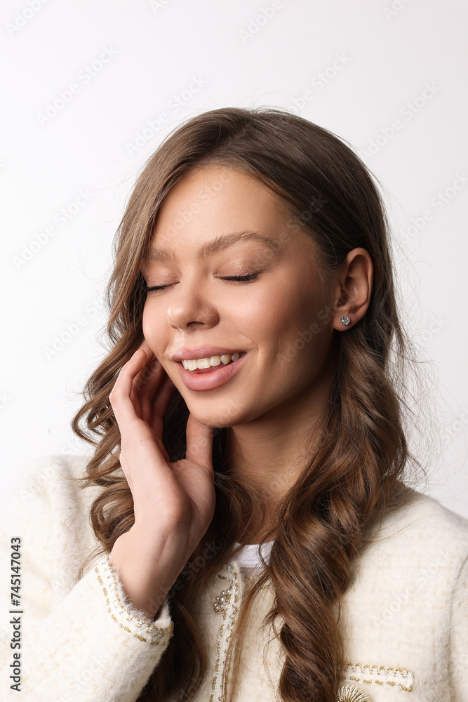 Beautiful young girl with fresh healthy skin. Woman advertise ear-rings. White background. Earrings closeup. Blond european woman with long hair with big lips, pretty smile. Cosmetology, scincare. Beautiful young girl with fresh healthy skin. Woman advertise ear-rings. White background. Earrings closeup. Blond european woman with long hair with big lips, pretty smile. Cosmetology, scincare.