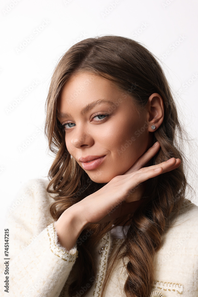 Beautiful young girl with fresh healthy skin. Woman advertise ear-rings. White background. Earrings closeup. Blond european woman with long hair with big lips, pretty smile. Cosmetology, scincare. Beautiful young girl with fresh healthy skin. Woman advertise ear-rings. White background. Earrings closeup. Blond european woman with long hair with big lips, pretty smile. Cosmetology, scincare.