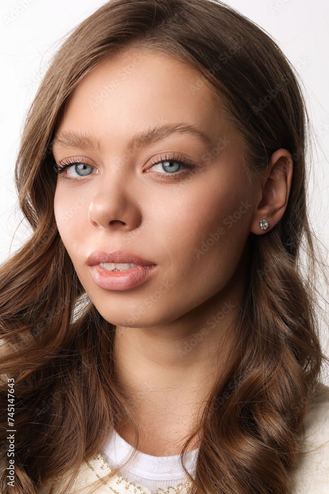 Beautiful young girl with fresh healthy skin. Woman advertise ear-rings. White background. Earrings closeup. Blond european woman with long hair with big lips, pretty smile. Cosmetology, scincare. Beautiful young girl with fresh healthy skin. Woman advertise ear-rings. White background. Earrings closeup. Blond european woman with long hair with big lips, pretty smile. Cosmetology, scincare.